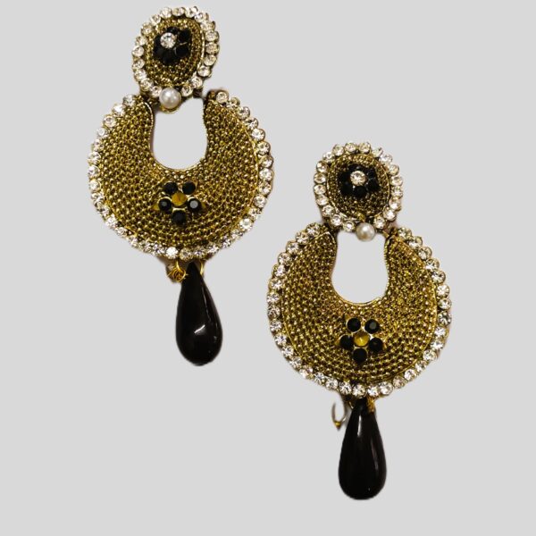 Intricate gold-toned metalwork on the Rajasthani Black Pearl Drop Earrings