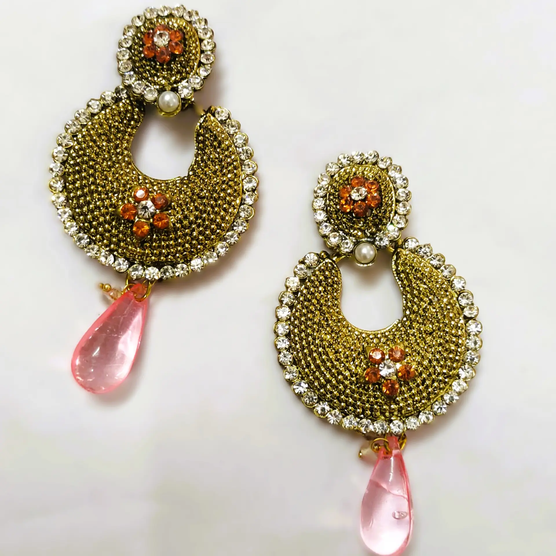 Rajasthani Gold-Plated Drop Earrings with pink gemstones and intricate gold-plated metalwork