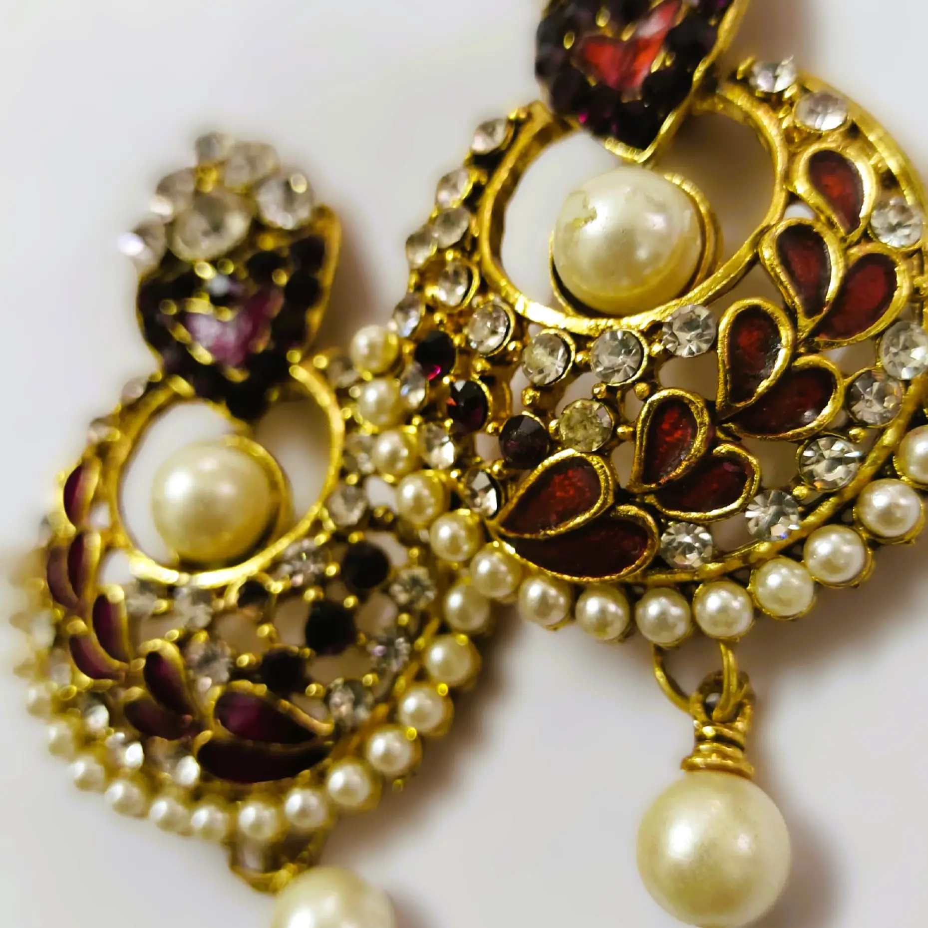 Close-up of the red enamel on the Ekmukhi Ladies Casting Earrings