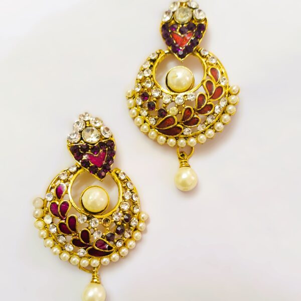 Intricate gold-toned metalwork on the Ekmukhi Ladies Casting Earrings