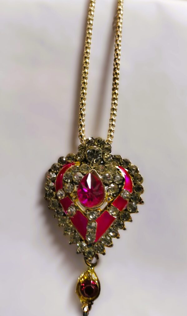 Intricate gold-toned metalwork on the Rajasthani Gold-Plated Heart-Shaped Necklace