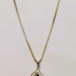 Traditional Indian Gold-Plated Teardrop Pendant Necklace with black and white stones and gold-toned metalwork