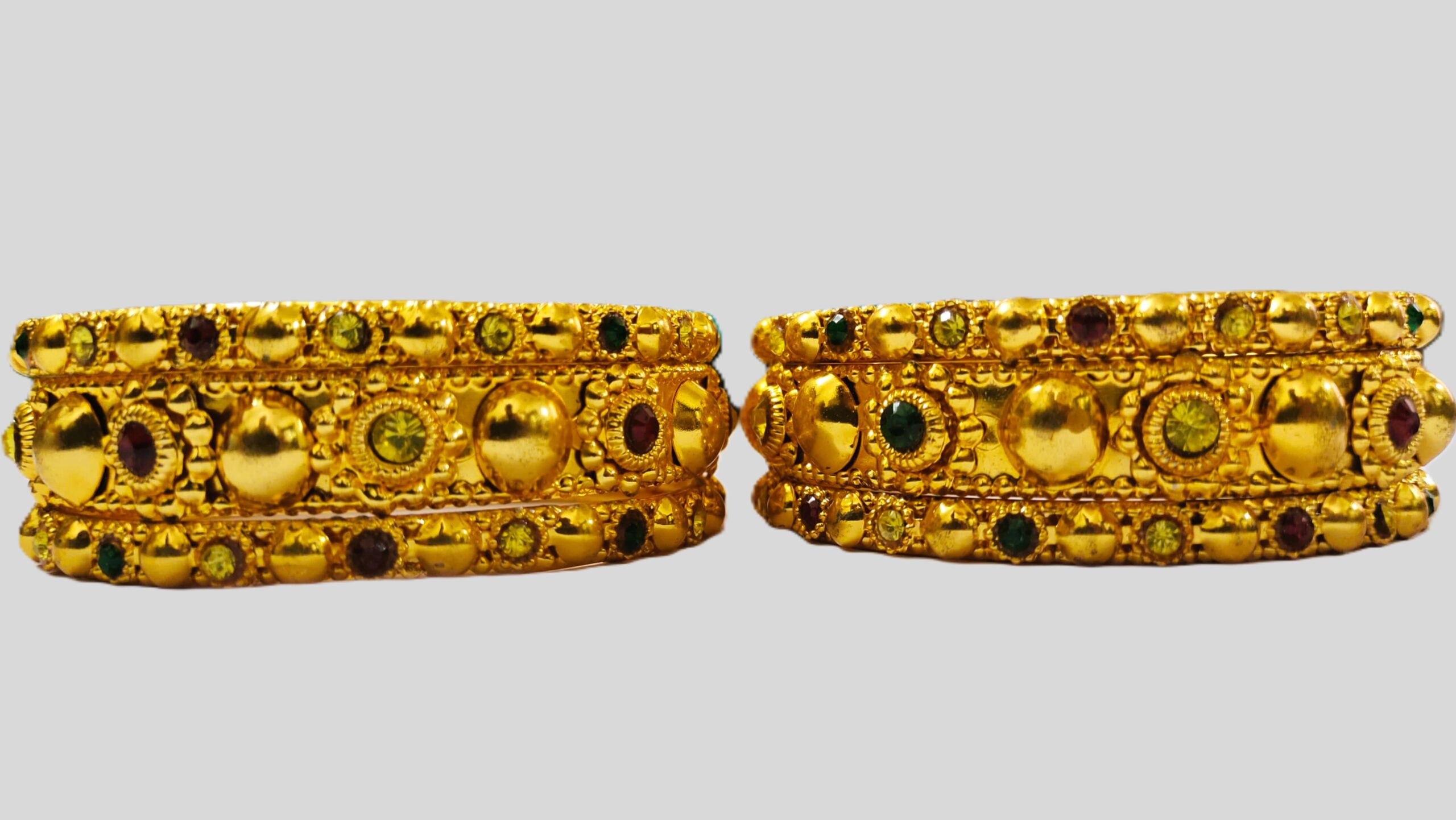 Close-up of the vibrant gemstones on the Rajasthani Gold-Plated Bangle Set