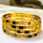 A traditional alloy bangle set with intricate designs and vibrant gemstones, perfect for any occasion.