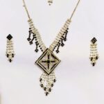 Rajasthani Gold-Plated Necklace Set with black and white stones and gold-toned metalwork