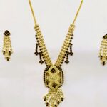 Rajasthani Gold-Plated Floral Necklace Set with vibrant gemstones and gold-toned metalwork