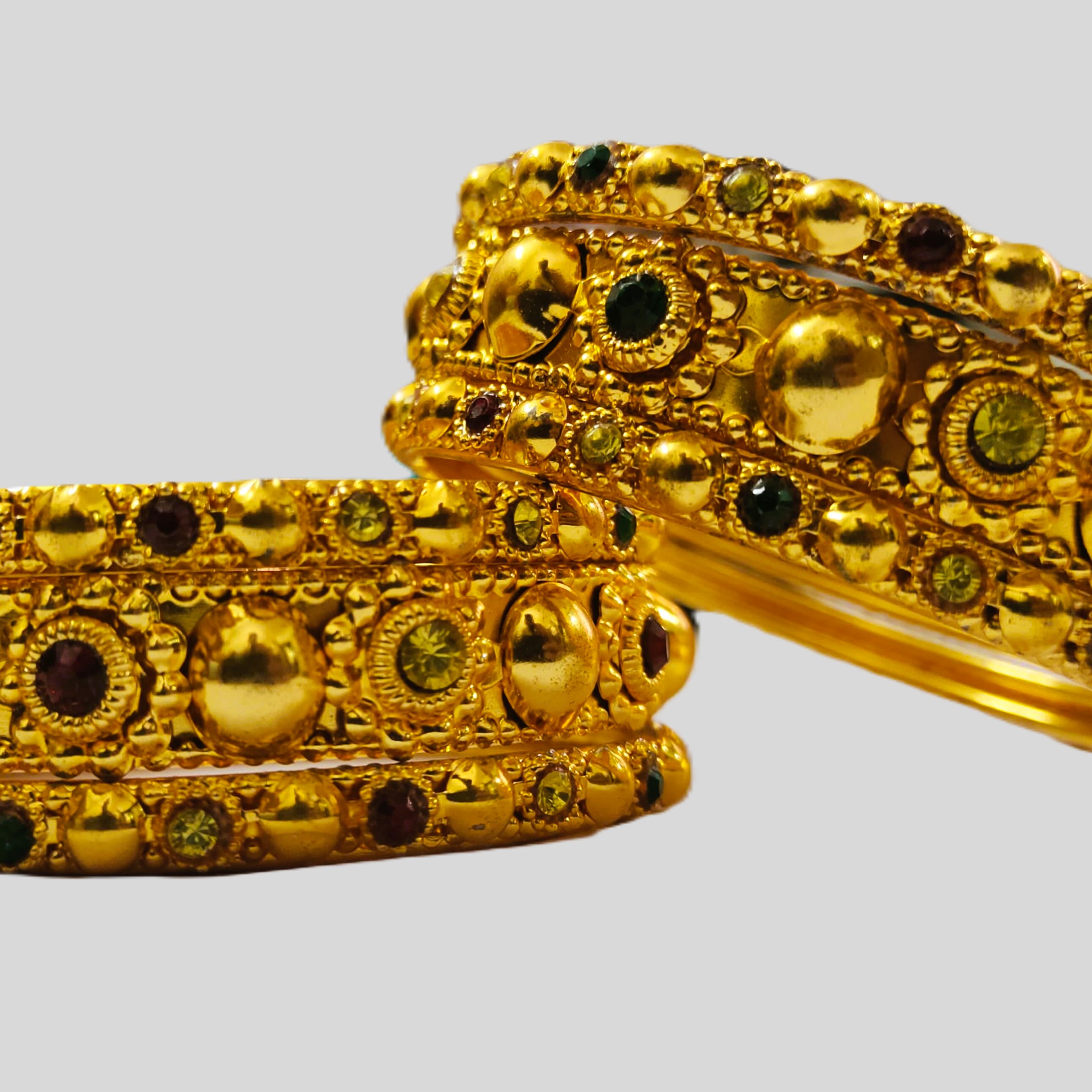 Rajasthani Gold-Plated Bangle Set with vibrant gemstones and intricate metalwork