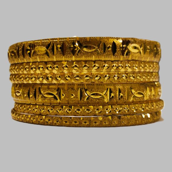 A close-up of the intricate designs on the gold-plated bangles.