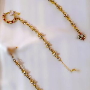 A close-up of the Rajasthani Royal Gold-Plated Bridal Nathni, showcasing the vibrant gemstones and gold-plated metalwork.