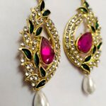 Exquisite Rajasthani Pink Gemstone Drop Earrings with intricate gold-toned metalwork and shimmering crystals