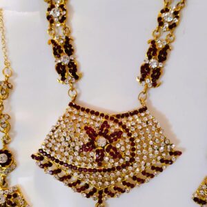 A close-up of the intricate details on the necklace, showcasing the Kundan and American diamond stones.