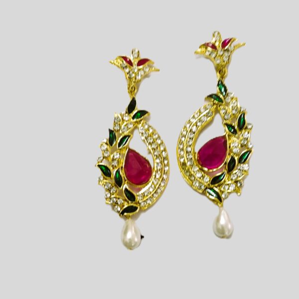 Exquisite Rajasthani Pink Gemstone Drop Earrings with intricate gold-toned metalwork and shimmering crystals.