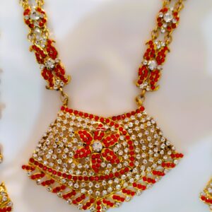 A close-up of the intricate details on the necklace, showcasing the Kundan and American diamond stones.