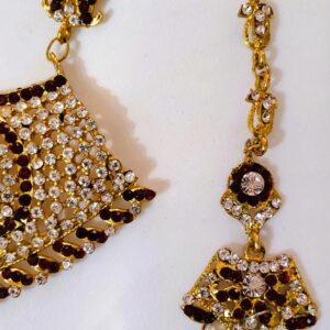 A close-up of the intricate details on the earrings, showcasing the Kundan and American diamond stones.