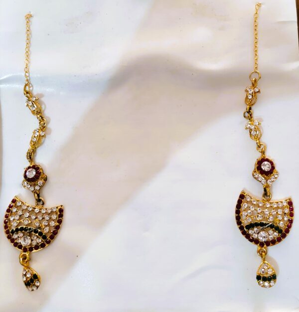 A close-up of the Rajasthani Royal Gold-Plated Bridal Earrings, showcasing the vibrant gemstones and gold-plated metalwork.