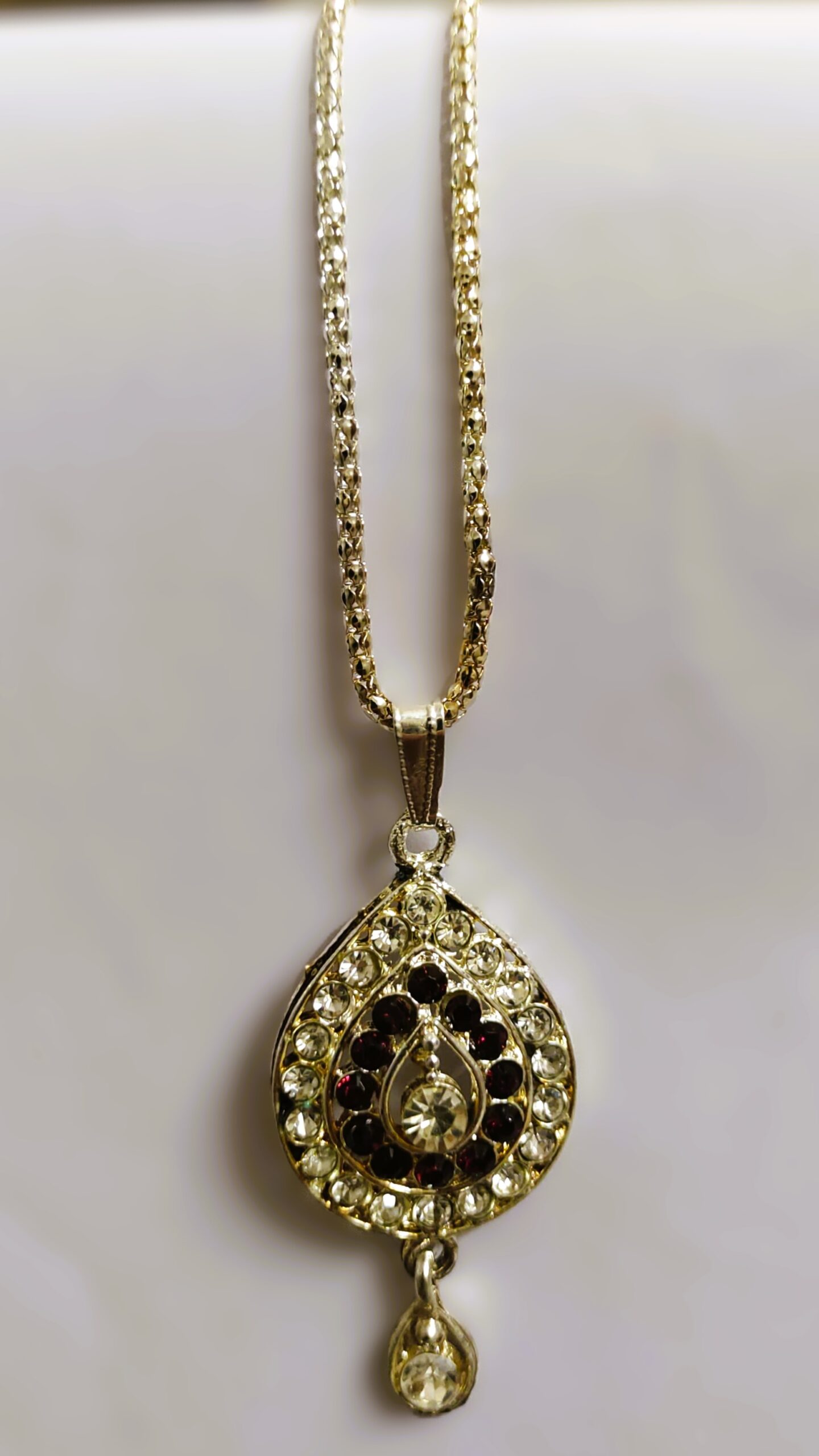 Intricate gold-toned metalwork on the Traditional Indian Gold-Plated Teardrop Pendant Necklace