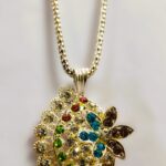 Intricate gold-toned metalwork on the Rajasthani Peacock-Inspired Pendant Necklace