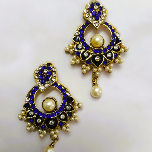 ntricate gold-toned metalwork on the Rajasthani Blue and White Enamel Drop Earrings