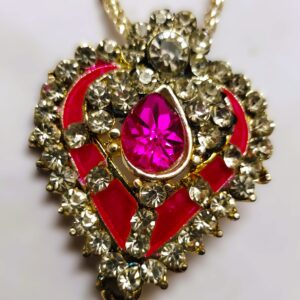 Close-up of the heart-shaped pendant on the Rajasthani Gold-Plated Heart-Shaped Necklace