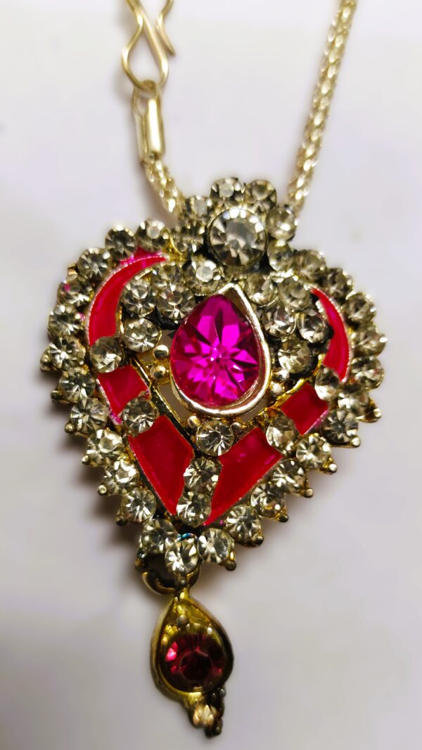 Close-up of the heart-shaped pendant on the Rajasthani Gold-Plated Heart-Shaped Necklace