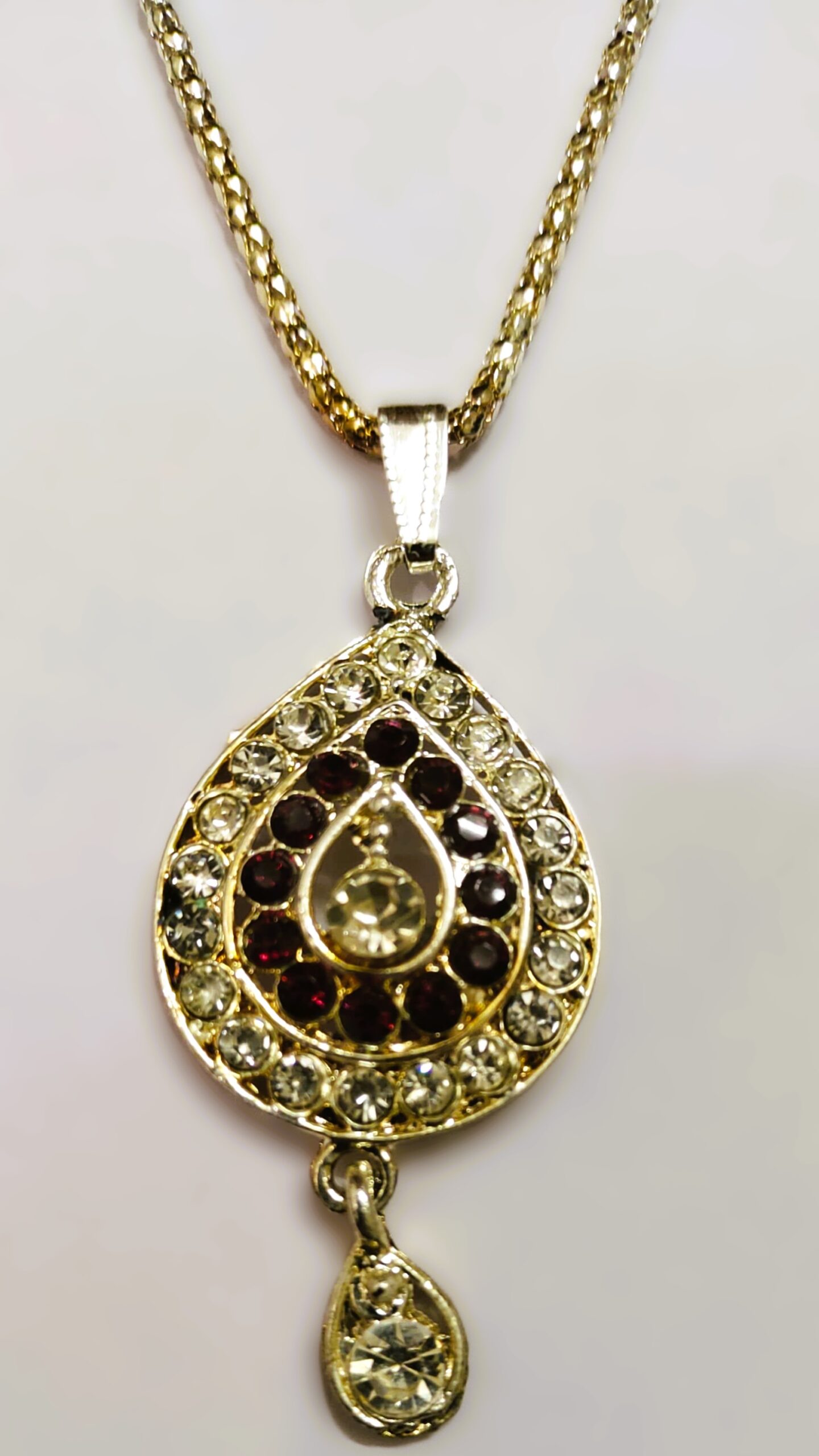 Close-up of the teardrop pendant on the Traditional Indian Gold-Plated Teardrop Pendant Necklace