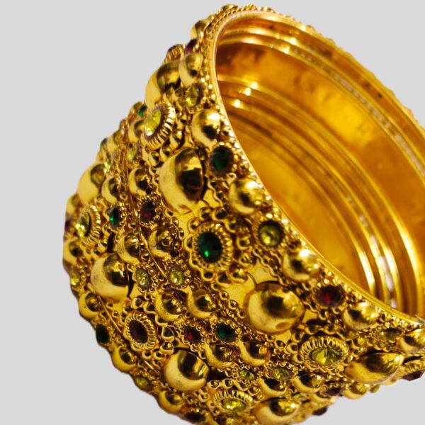 Intricate gold-plated metalwork on the Rajasthani Gold-Plated Bangle Set